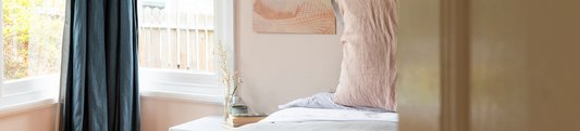 Soft bedroom scene with pink pilow